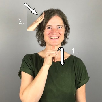 Porträtfoto Frau Jakob. Kinnlanges dunkelbraues Haar, helle Haut.