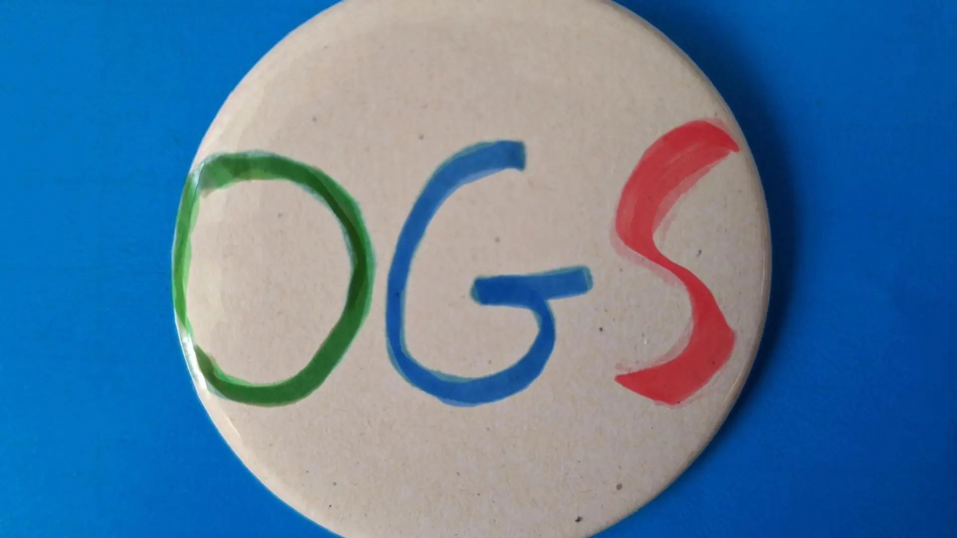 Symbolbild: Button mit OGS-Schriftzug