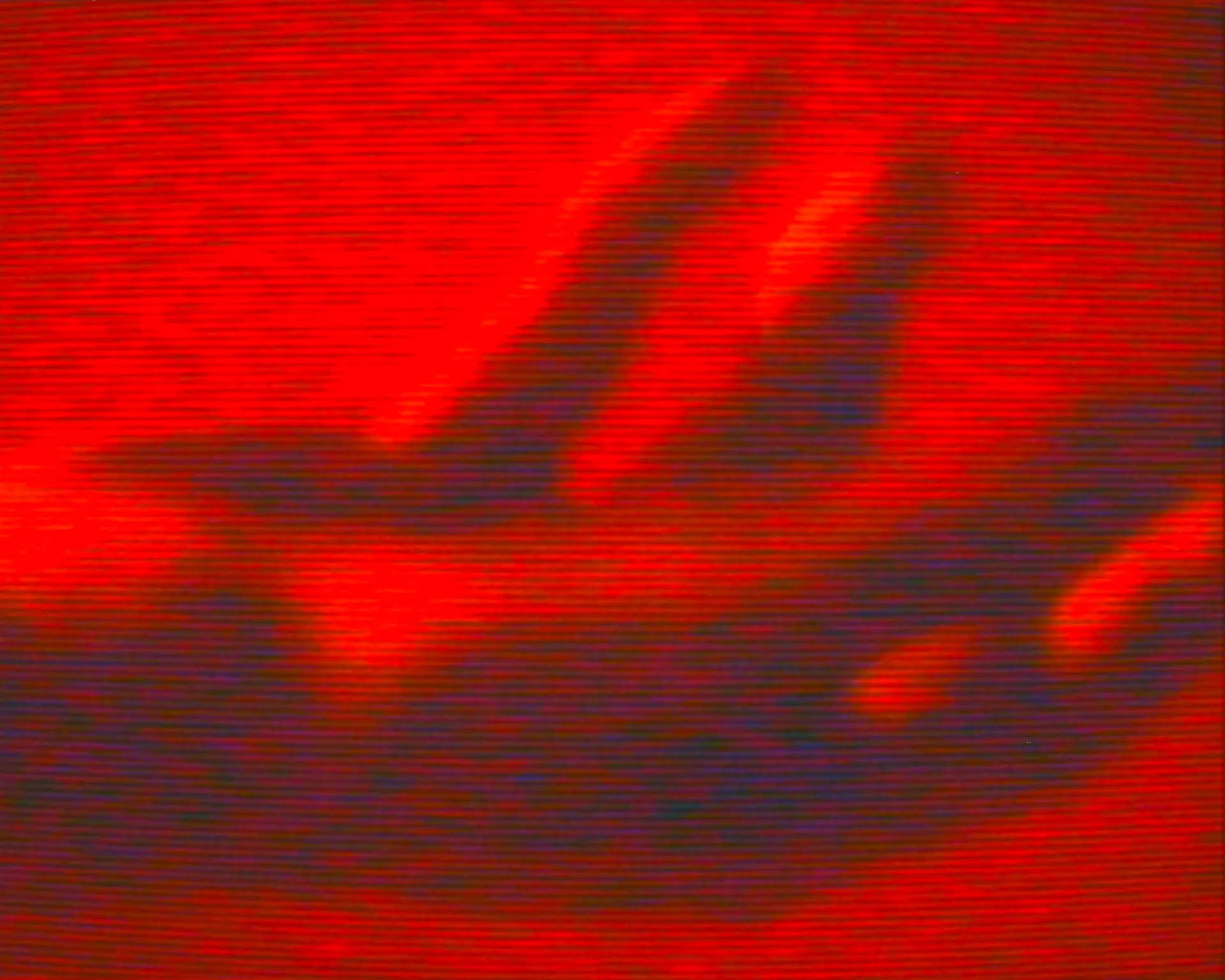 Zwei Hände auf rot-schwarzer Fläche