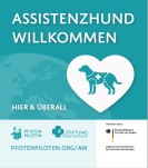 Ein grüner Aufkleber mit weißer Schrift "Assistenzhund willkommen" und der Zeichnung eines Hundes in einem Herz.