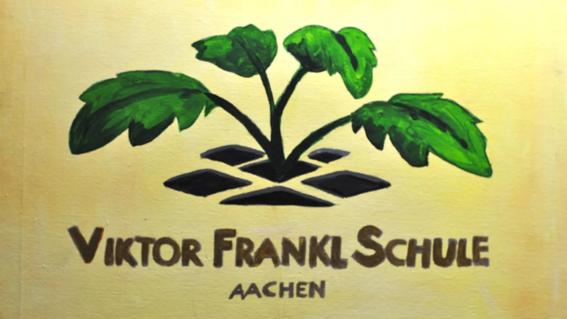 Foto von einem Gemälde von einer grünen, prächtigen Pflanze; darunter ist der Schulname geschrieben.